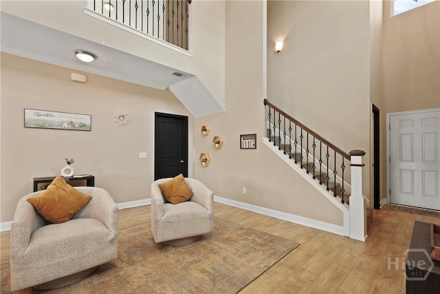 806 Fairview Cir, Hinesville, GA 31313 - entrance foyer featuring a high ceiling, stairway, wood finished floors, and baseboards