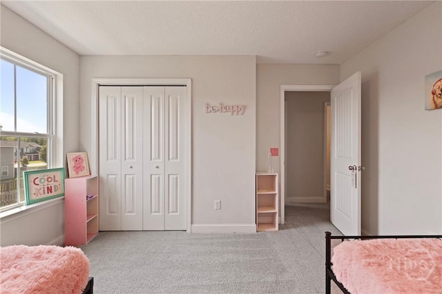 806 Fairview Cir, Hinesville, GA 31313 - carpeted bedroom featuring baseboards and a closet