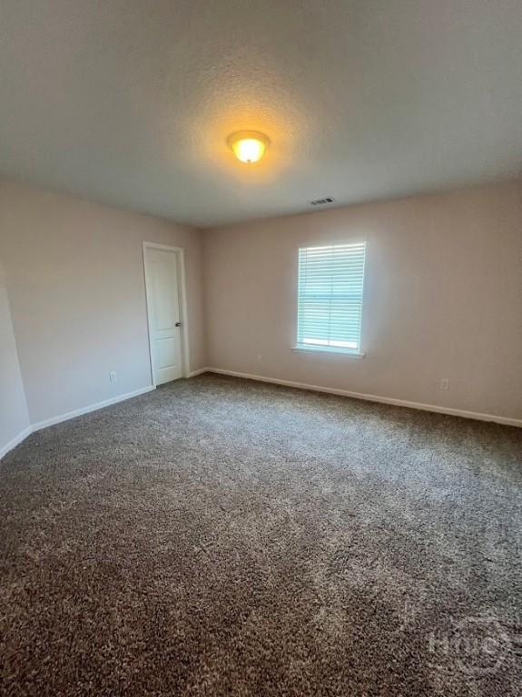 139 Sams Dr, Guyton, GA 31312 - empty room with baseboards and carpet
