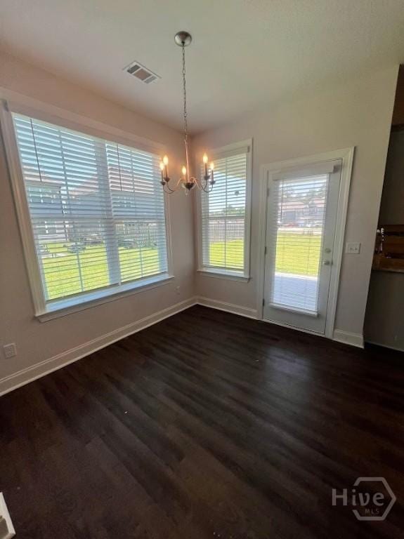 139 Sams Dr, Guyton, GA 31312 - unfurnished dining area featuring a chandelier, dark wood-style floors, and baseboards