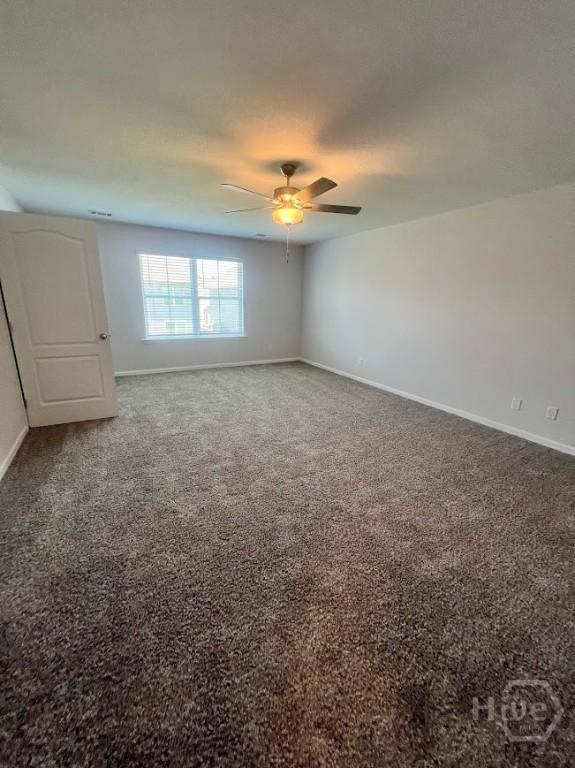 139 Sams Dr, Guyton, GA 31312 - carpeted empty room featuring baseboards and a ceiling fan