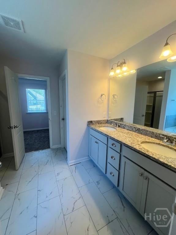 139 Sams Dr, Guyton, GA 31312 - full bathroom featuring baseboards, double vanity, and marble look tiles
