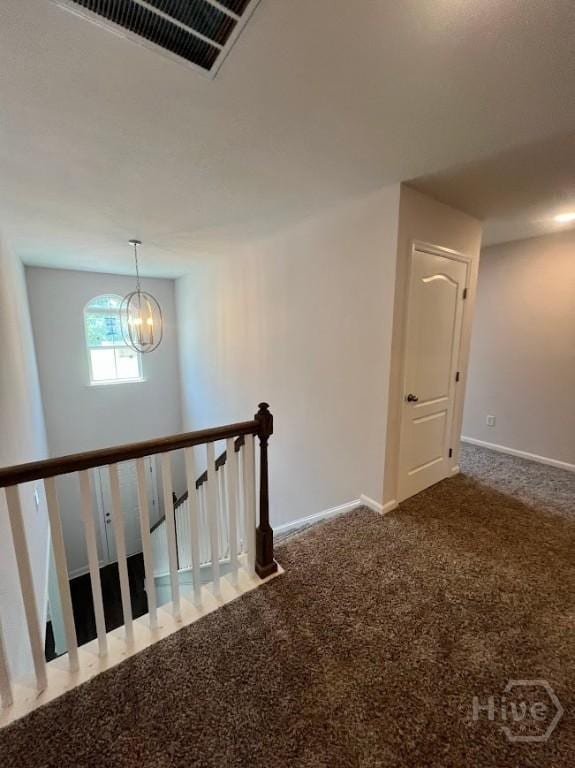 139 Sams Dr, Guyton, GA 31312 - stairway featuring a chandelier, baseboards, and carpet