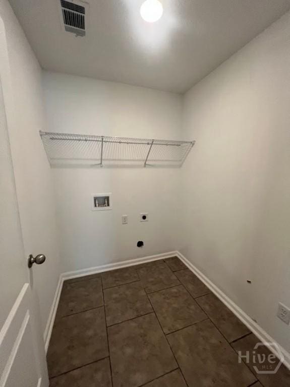 139 Sams Dr, Guyton, GA 31312 - washroom with hookup for a washing machine, hookup for an electric dryer, baseboards, and dark tile patterned flooring
