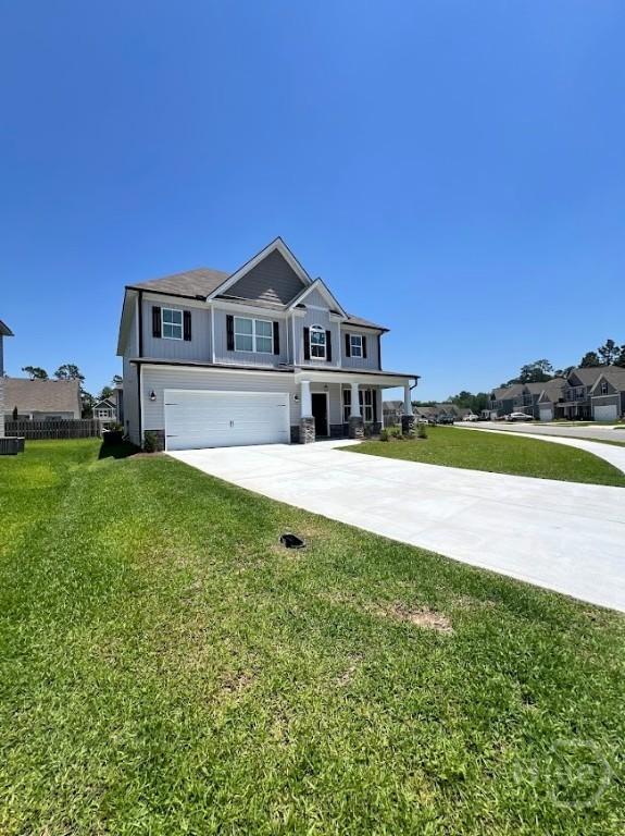 139 Sams Dr, Guyton, GA 31312 - view of front facade featuring an attached garage and concrete driveway