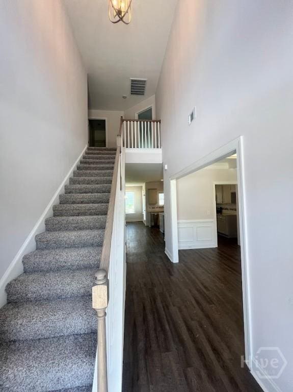 139 Sams Dr, Guyton, GA 31312 - stairs featuring a towering ceiling and wood finished floors