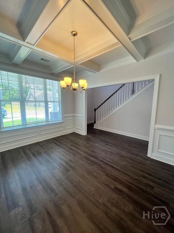 139 Sams Dr, Guyton, GA 31312 - unfurnished living room with a chandelier, coffered ceiling, dark wood-type flooring, beam ceiling, and stairs
