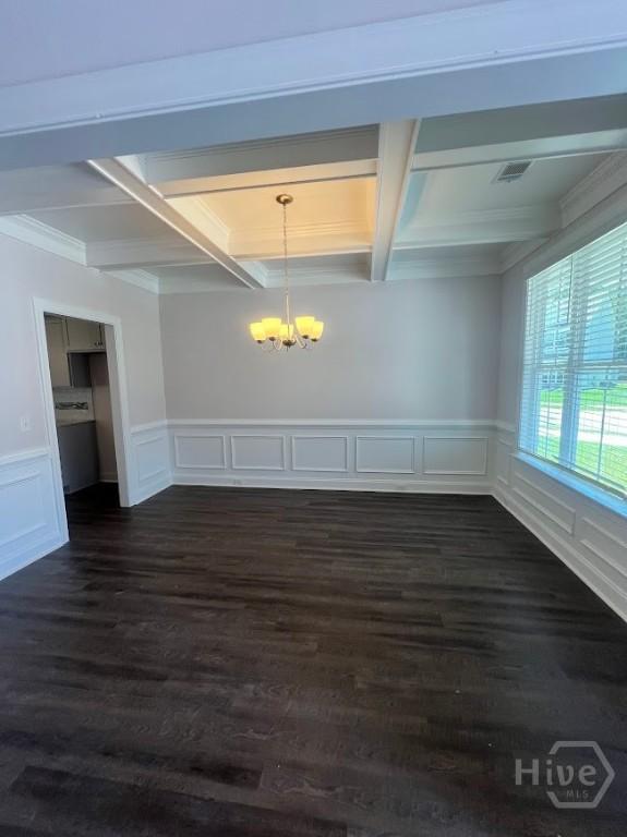 139 Sams Dr, Guyton, GA 31312 - unfurnished dining area with a chandelier, coffered ceiling, beamed ceiling, crown molding, and dark wood-type flooring