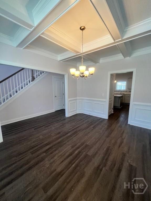 139 Sams Dr, Guyton, GA 31312 - unfurnished dining area with a chandelier, coffered ceiling, stairway, a decorative wall, and beamed ceiling