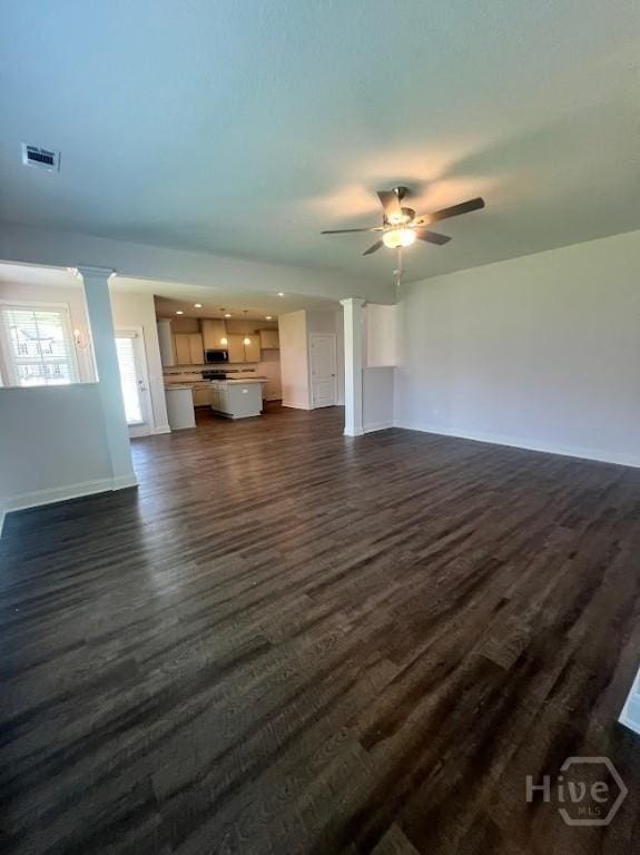 139 Sams Dr, Guyton, GA 31312 - unfurnished living room with dark wood-style flooring, baseboards, and ceiling fan