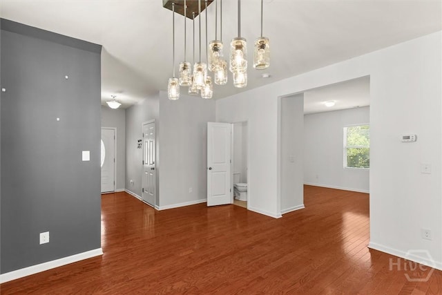 4 Crest View Cir, Pooler, GA 31322 - spare room with wood finished floors, baseboards, and a chandelier