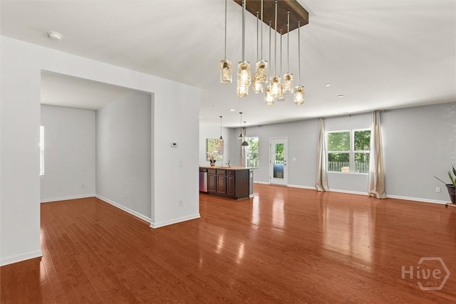 4 Crest View Cir, Pooler, GA 31322 - unfurnished living room with wood finished floors, baseboards, and a chandelier