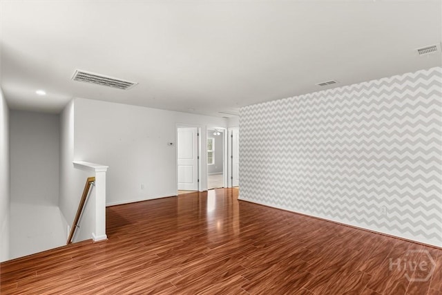 4 Crest View Cir, Pooler, GA 31322 - spare room with wallpapered walls, wood finished floors, and baseboards