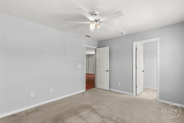 4 Crest View Cir, Pooler, GA 31322 - unfurnished bedroom with light colored carpet, baseboards, a spacious closet, and a ceiling fan
