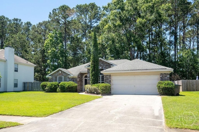 143 Village Lake Dr, Pooler, GA 31322 - ranch-style house featuring concrete driveway, a garage, stone siding, and roof with shingles