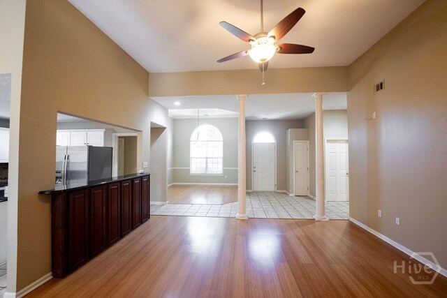 143 Village Lake Dr, Pooler, GA 31322 - entryway featuring ornate columns, light wood-type flooring, baseboards, and a ceiling fan
