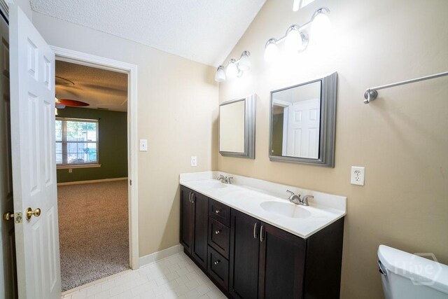 143 Village Lake Dr, Pooler, GA 31322 - full bathroom with double vanity, toilet, tile patterned floors, a textured ceiling, and baseboards