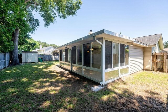 143 Village Lake Dr, Pooler, GA 31322 - back of property with a sunroom and a chimney