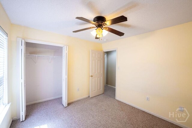 143 Village Lake Dr, Pooler, GA 31322 - unfurnished bedroom with light colored carpet, a closet, baseboards, and a ceiling fan