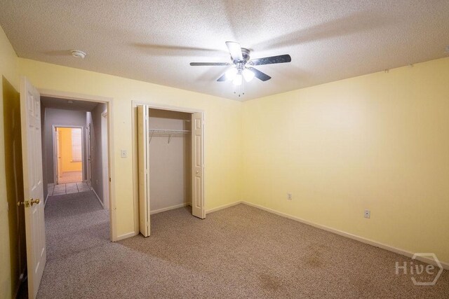 143 Village Lake Dr, Pooler, GA 31322 - unfurnished bedroom featuring light carpet, a textured ceiling, a closet, baseboards, and ceiling fan