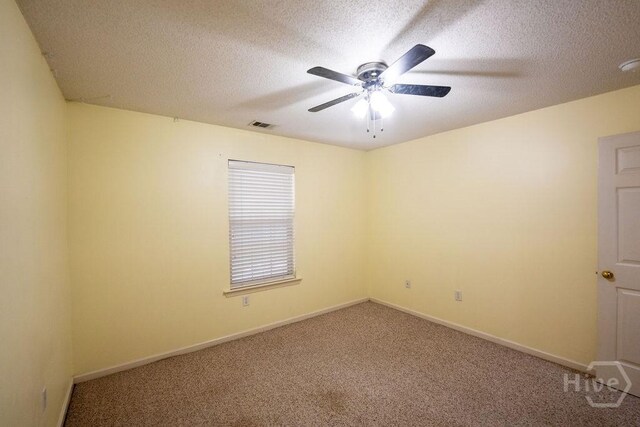 143 Village Lake Dr, Pooler, GA 31322 - carpeted empty room with ceiling fan, a textured ceiling, and baseboards