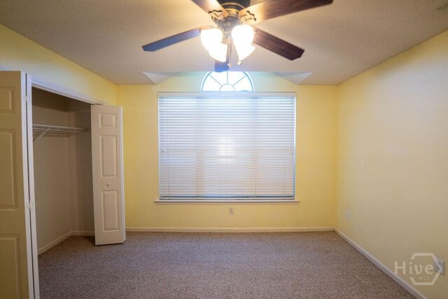 143 Village Lake Dr, Pooler, GA 31322 - unfurnished bedroom with carpet flooring, a closet, baseboards, lofted ceiling, and a ceiling fan