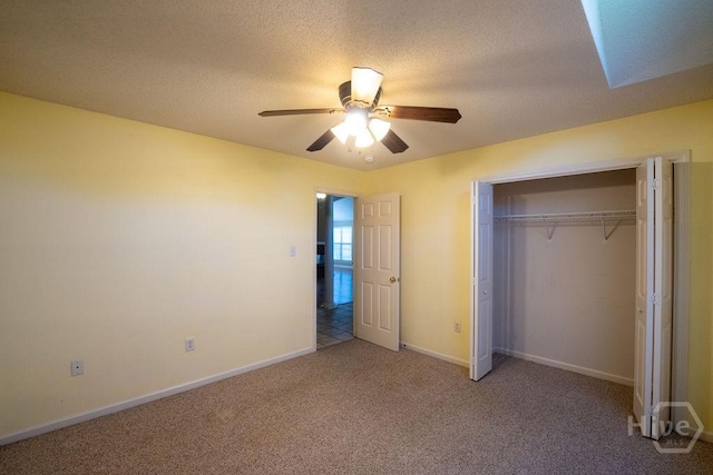 143 Village Lake Dr, Pooler, GA 31322 - unfurnished bedroom with carpet, a closet, baseboards, a ceiling fan, and a textured ceiling