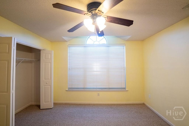 143 Village Lake Dr, Pooler, GA 31322 - unfurnished bedroom with carpet, a closet, baseboards, a textured ceiling, and vaulted ceiling