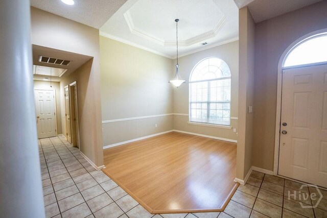143 Village Lake Dr, Pooler, GA 31322 - entryway featuring healthy amount of natural light, light tile patterned floors, a raised ceiling, and ornamental molding