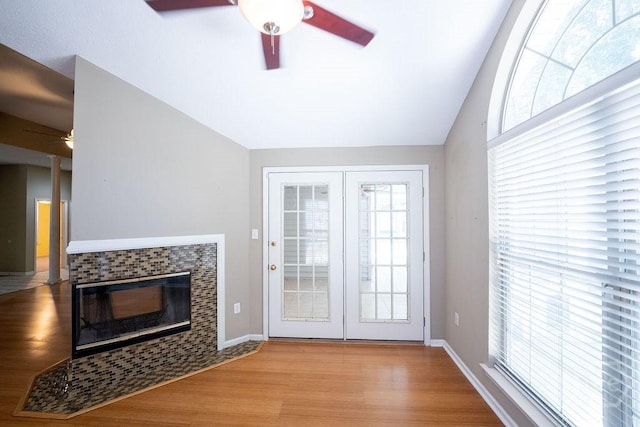 143 Village Lake Dr, Pooler, GA 31322 - unfurnished living room with ceiling fan, lofted ceiling, wood finished floors, baseboards, and decorative columns