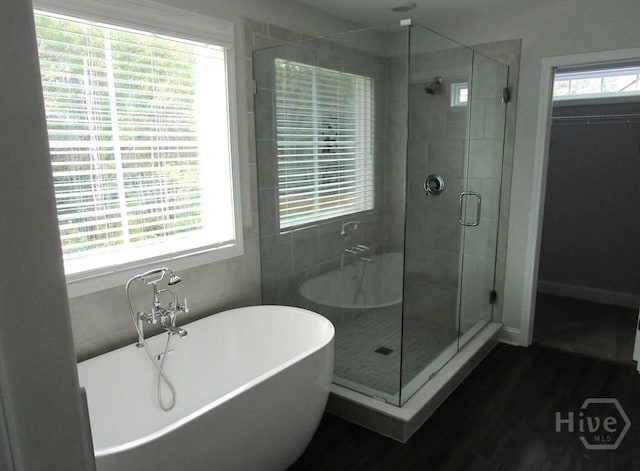 32 Brookhaven Dr, Savannah, GA 31407 - bathroom with a shower stall, a freestanding tub, and wood finished floors