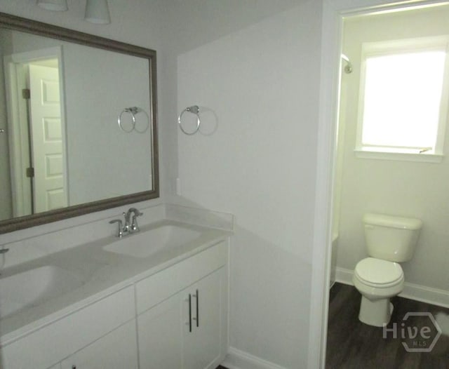 32 Brookhaven Dr, Savannah, GA 31407 - bathroom featuring double vanity, toilet, baseboards, and  shower combination