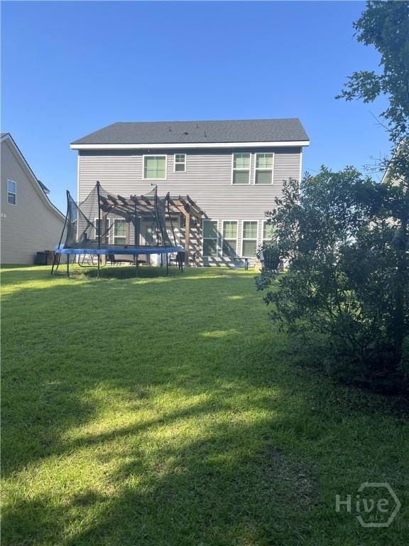 32 Brookhaven Dr, Savannah, GA 31407 - rear view of property featuring a trampoline and a yard