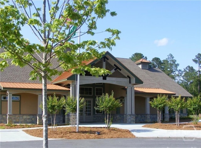 32 Brookhaven Dr, Savannah, GA 31407 - view of front of home featuring stucco siding, stone siding, and a shingled roof