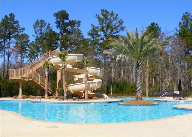 32 Brookhaven Dr, Savannah, GA 31407 - community pool featuring a water slide, a patio, and stairway