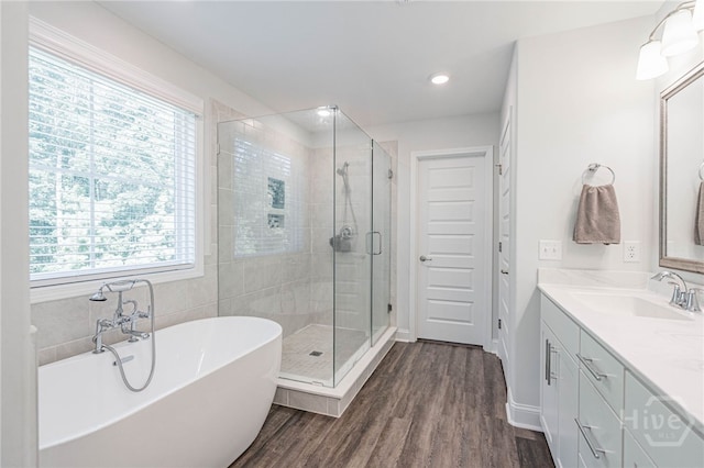 32 Brookhaven Dr, Savannah, GA 31407 - bathroom featuring healthy amount of natural light, vanity, a soaking tub, a shower stall, and recessed lighting