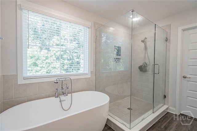 32 Brookhaven Dr, Savannah, GA 31407 - full bathroom featuring a soaking tub, a stall shower, and wood finished floors