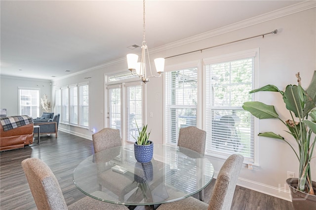32 Brookhaven Dr, Savannah, GA 31407 - dining area featuring dark wood-style flooring, a chandelier, plenty of natural light, and crown molding
