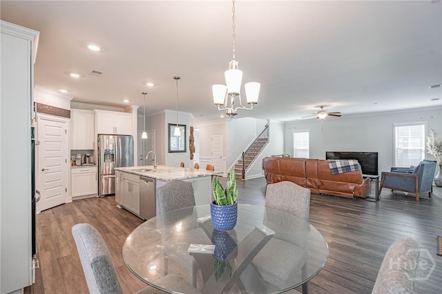 32 Brookhaven Dr, Savannah, GA 31407 - dining area featuring healthy amount of natural light, crown molding, a ceiling fan, stairs, and recessed lighting