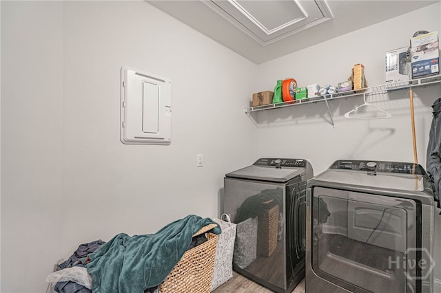 32 Brookhaven Dr, Savannah, GA 31407 - washroom with washing machine and clothes dryer, electric panel, and light wood-style floors