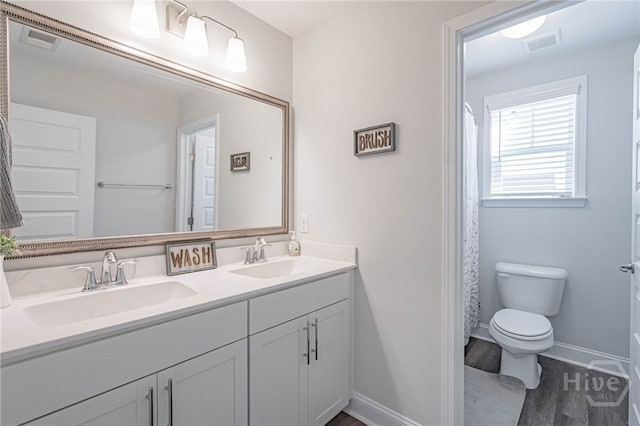 32 Brookhaven Dr, Savannah, GA 31407 - full bathroom featuring double vanity and wood finished floors