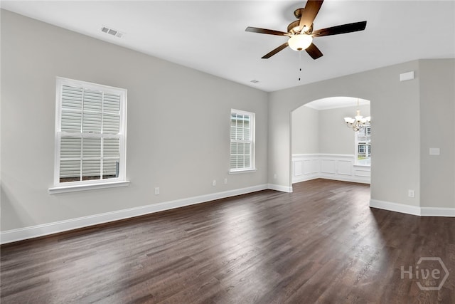 142 Guana Ln, Bloomingdale, GA 31302 - unfurnished room featuring a chandelier, arched walkways, a ceiling fan, dark wood-style floors, and baseboards