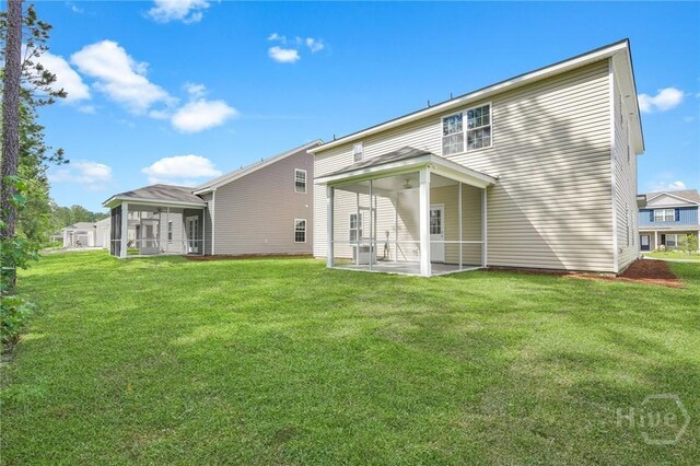 142 Guana Ln, Bloomingdale, GA 31302 - back of property with a sunroom, a yard, a patio area, and cooling unit