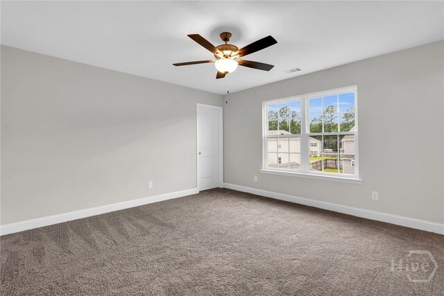 142 Guana Ln, Bloomingdale, GA 31302 - spare room with carpet, baseboards, and a ceiling fan