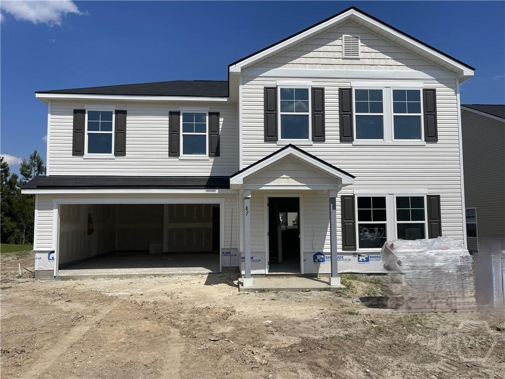 87 Marsh Salt Ln, Port Wentworth, GA 31407 - view of front facade with a garage and dirt driveway