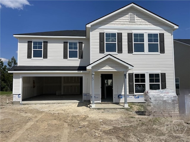 87 Marsh Salt Ln, Port Wentworth, GA 31407 - view of front facade with a garage and dirt driveway