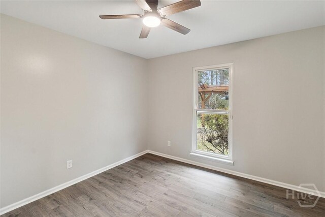 4342 Mud Rd, Brooklet, GA 30415 - spare room with wood finished floors, baseboards, and ceiling fan