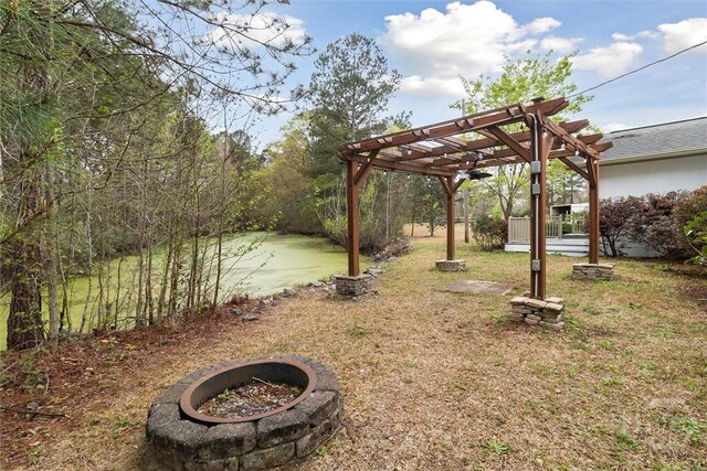 4342 Mud Rd, Brooklet, GA 30415 - view of grassy yard with a fire pit and a pergola