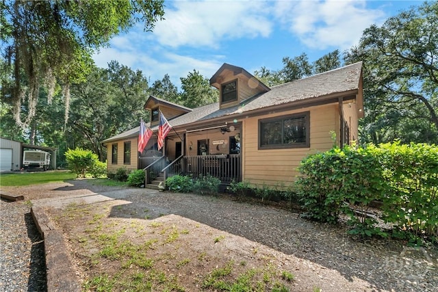 124 Denham Ln, Midway, GA 31320 - view of front facade with covered porch and a ceiling fan