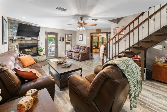 124 Denham Ln, Midway, GA 31320 - living area featuring light wood-type flooring, a fireplace, stairway, a ceiling fan, and recessed lighting